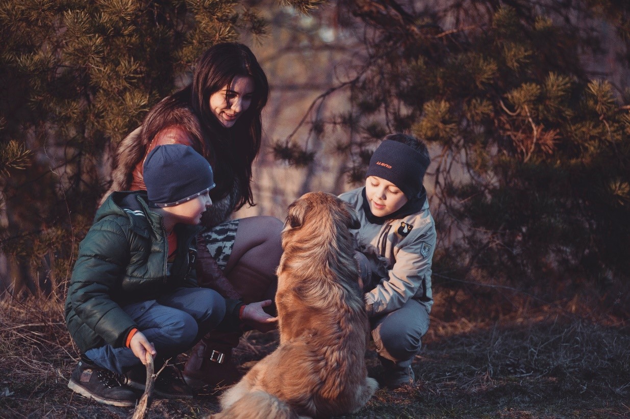 Family with dog outside